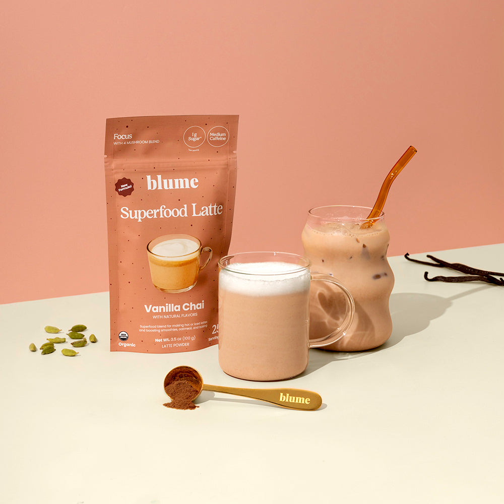 Blume Superfood Latte Vanilla Chai package with two glasses of the drink on a beige background