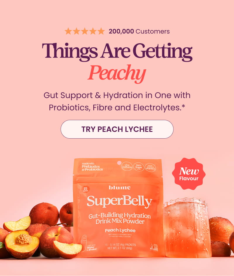 New SuperBelly Peach Lychee Gut-Building Hydration Drink Mix Powder with juicy peaches on a pink background