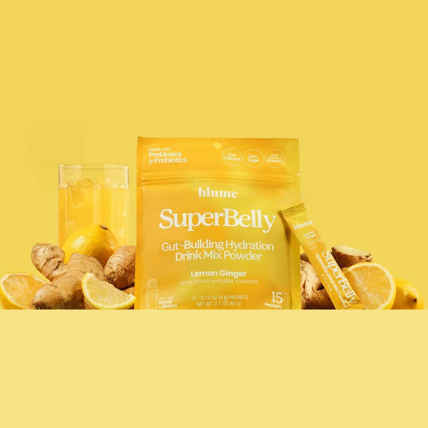 Blume SuperBelly drink mix package with lemons, ginger, and a glass on a yellow background