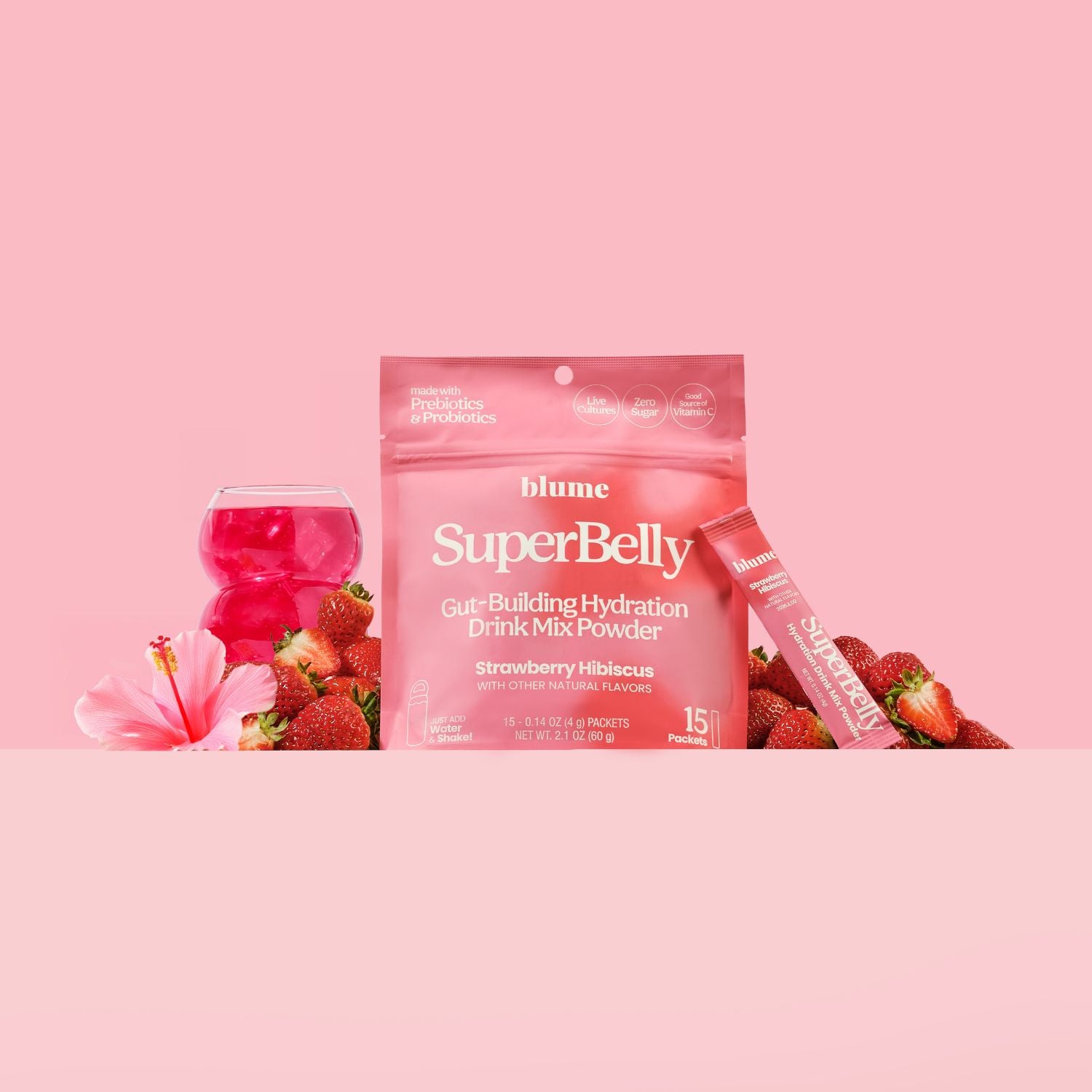 Blume SuperBelly drink mix package with strawberries and a pink background