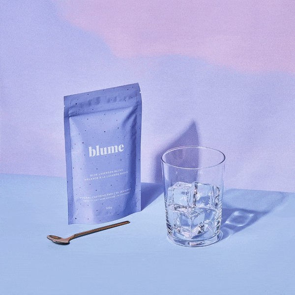 A gif of Blue Lavender latte filled in a glass cup, a hand putting a glass blue straw in a cup, with a bag of Blume Blue Lavender Latte and gold spoon on a purple gradient background