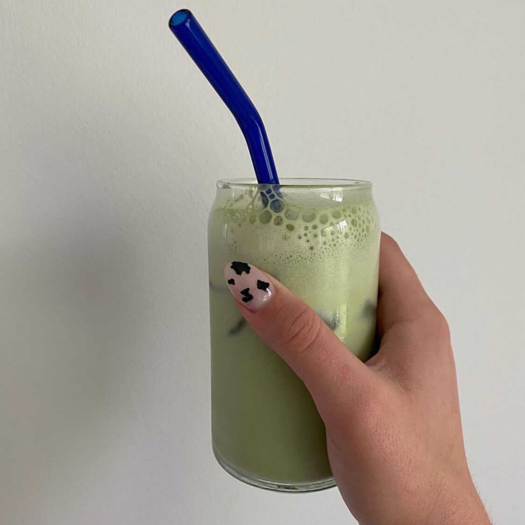 A glass of iced matcha latte made with Blume Matcha Coconut Blend taken by @faithhurtado