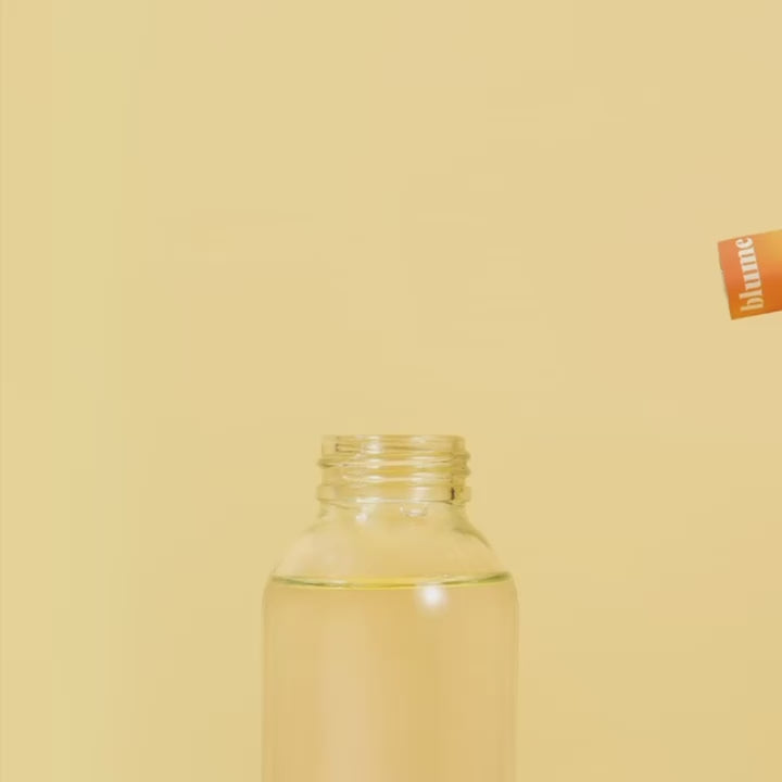 GIF showing how to make our SuperBelly Mango Passion Fruit Drink mix in a glass bottle